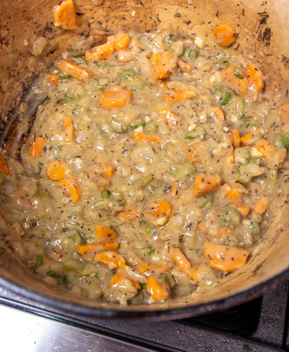 Butter added to the pot of sautéed vegetables and flour to make a roux.