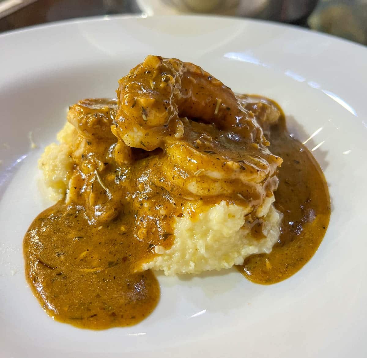 close up of seafood gumbo over grits