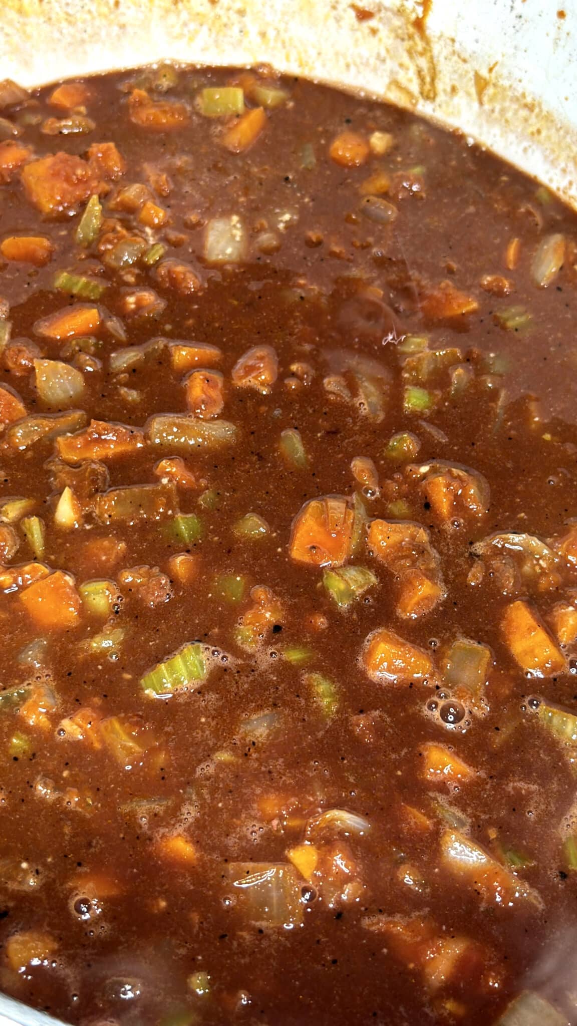 red wine mixed with mirepoix in a dutch oven