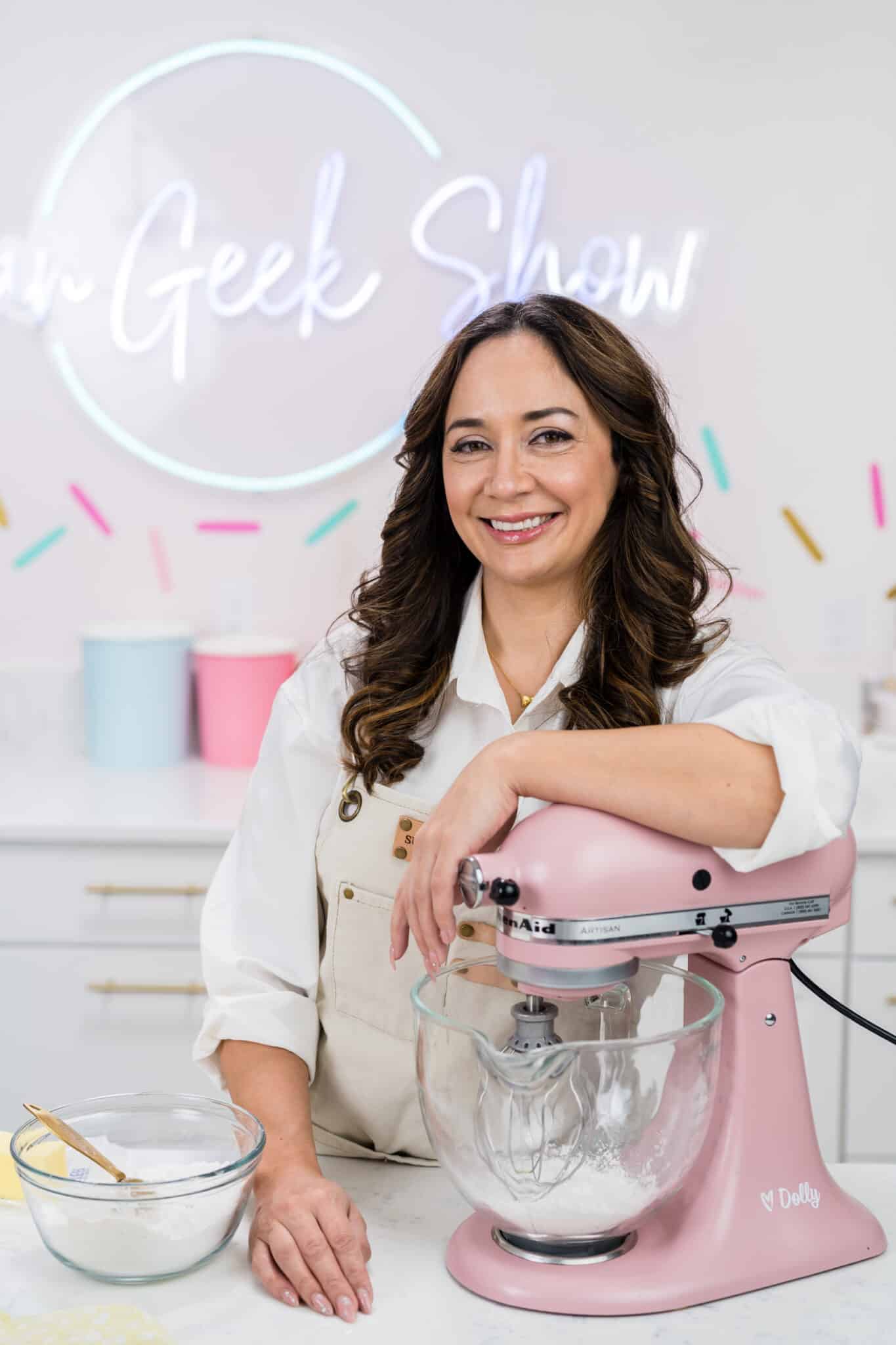 close up of liz marek with a pink stand mixer