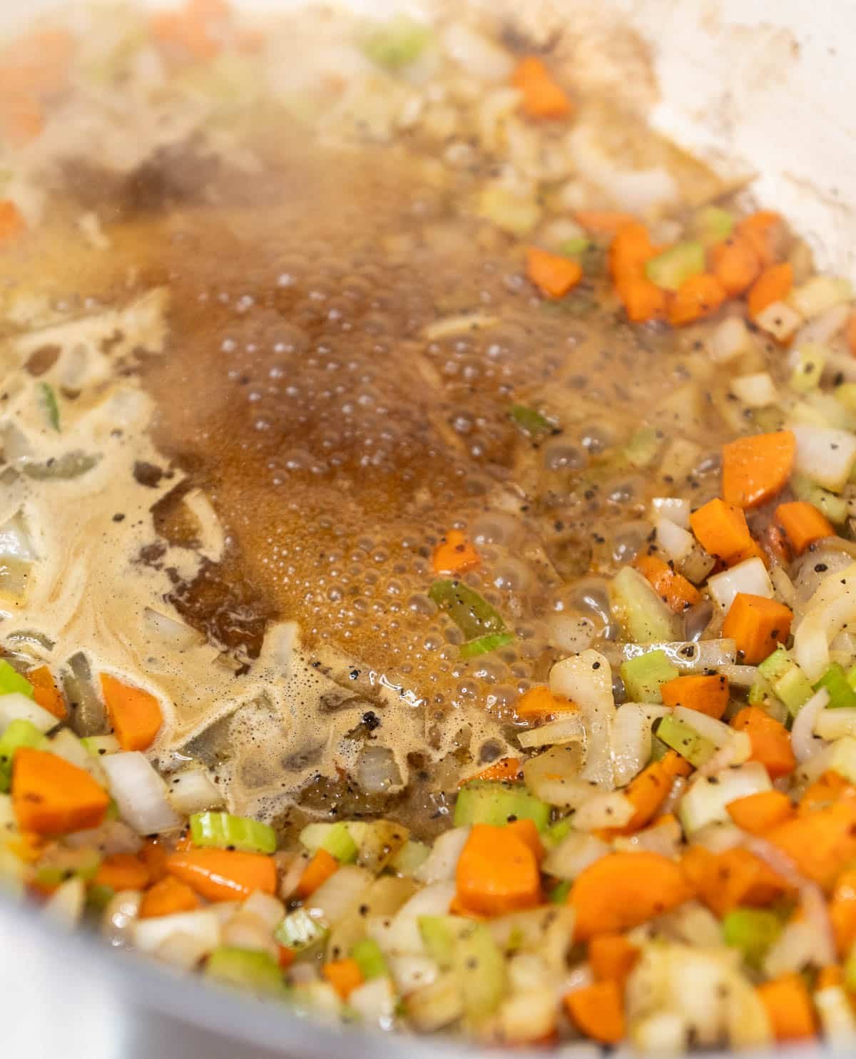 Butter is browning with veggies in the dutch oven. 