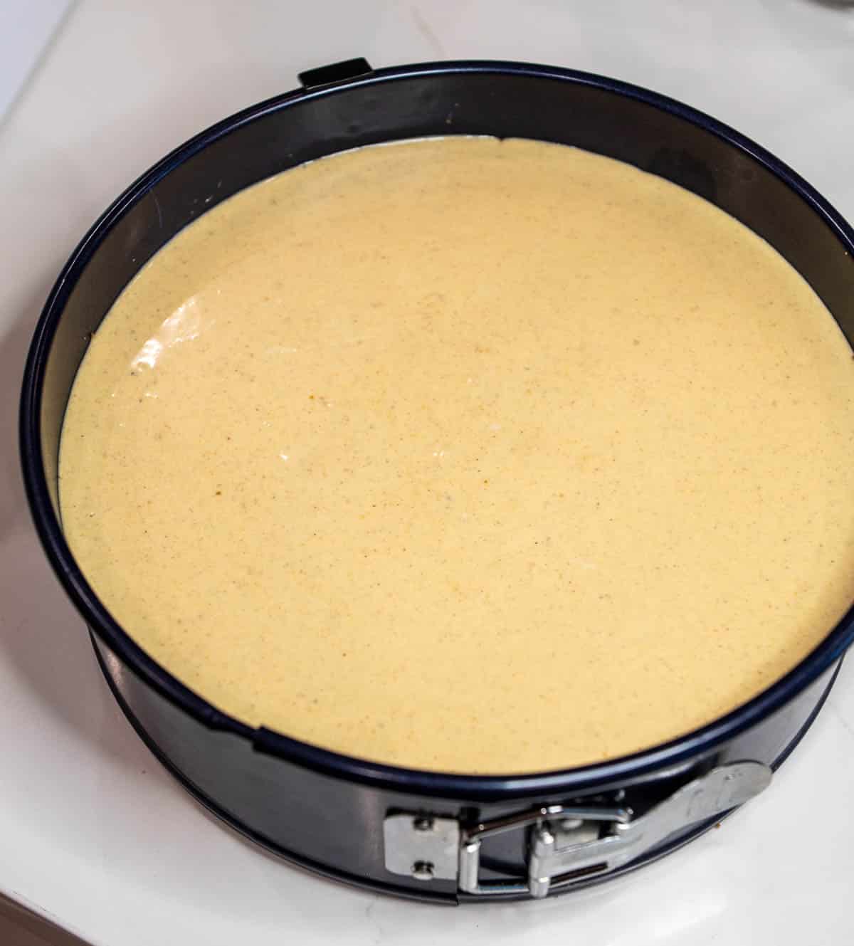 Cheesecake filling in a spring-form pan. 