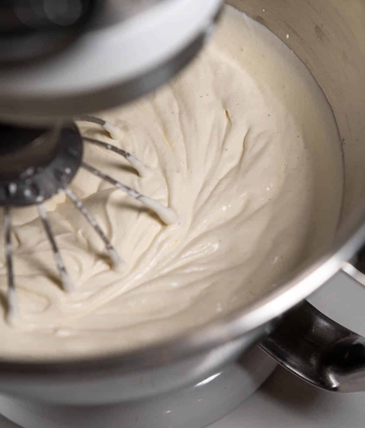 Whipped cream in a stand mixer. 