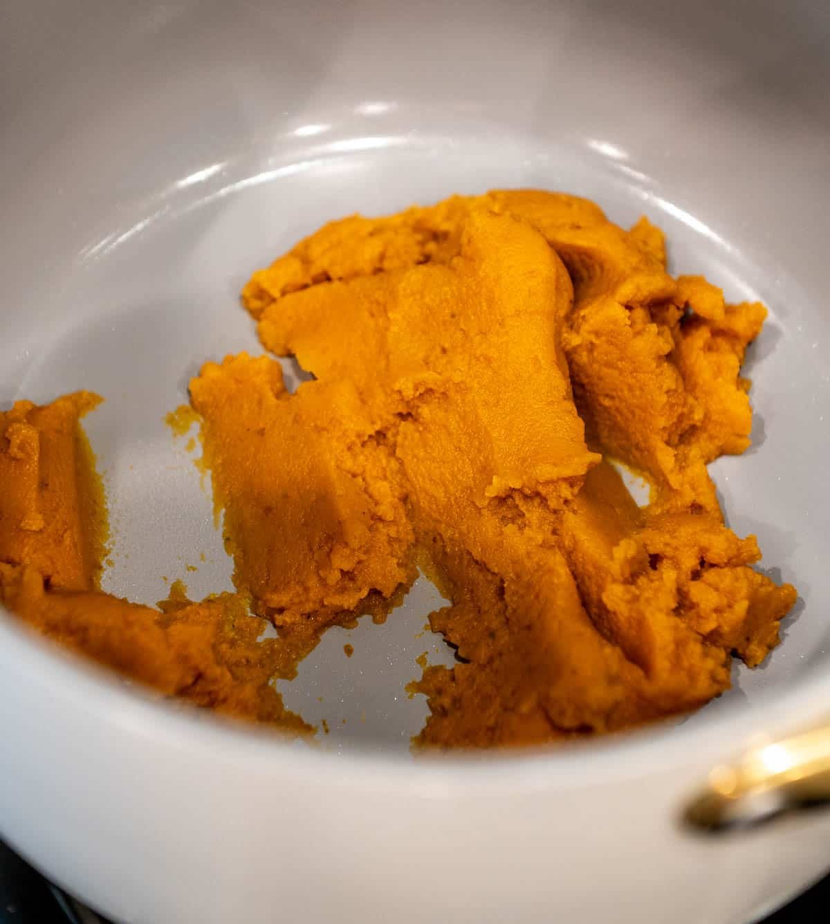 Pumpkin puree in a pot.