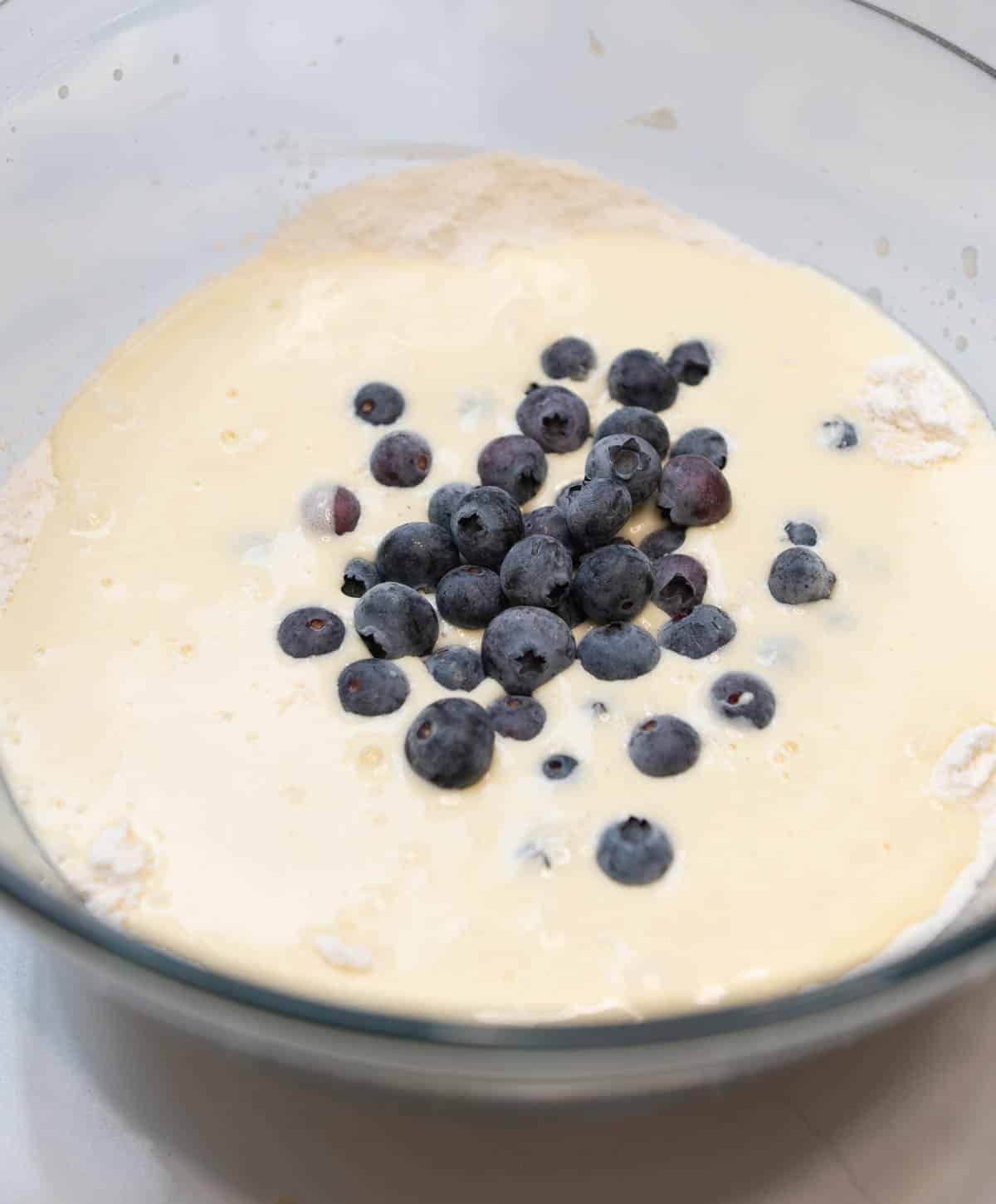 Blueberries are added to the batter. 