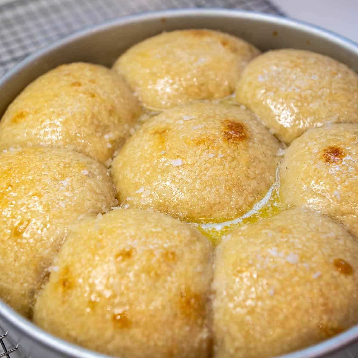 Cooled rolls brushed with more butter and topped with a sprinkle of flaky salt.