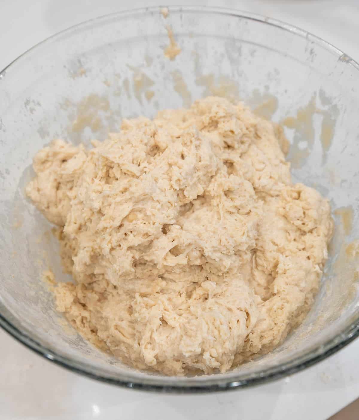 Wet and dry ingredients fully combined in a large bowl.