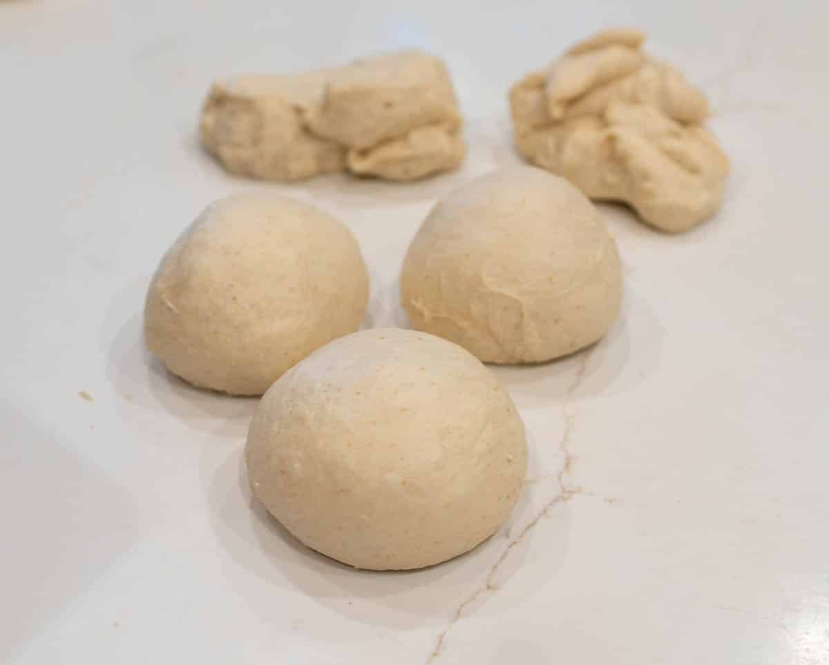 Individual rolls shaped into perfectly round balls. 