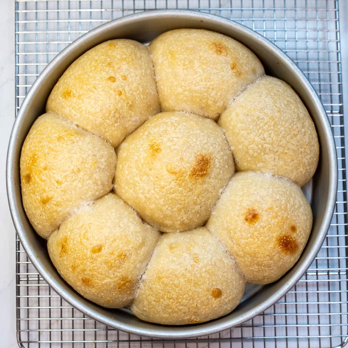 Sourdough rolls baked in a pan.