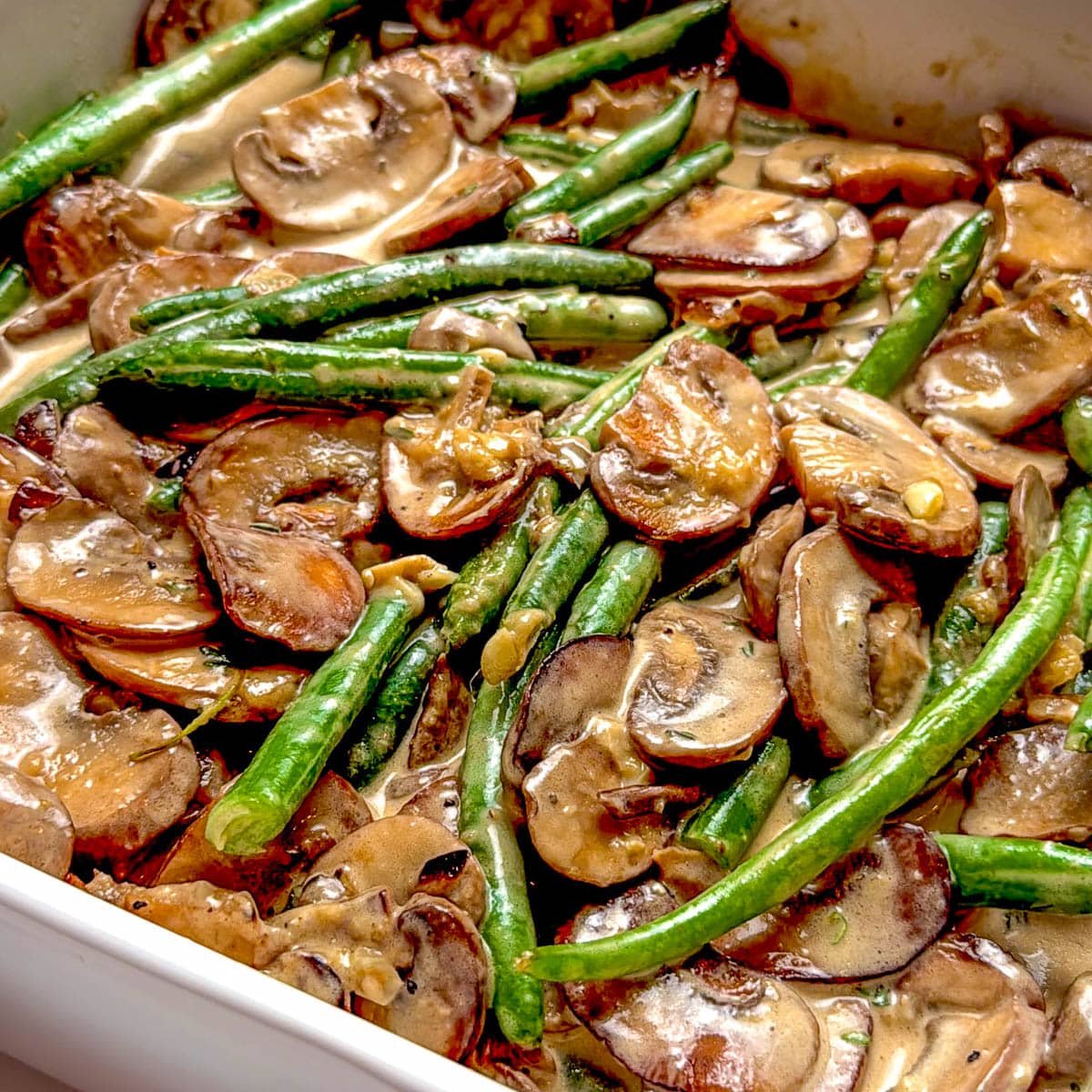 close up of green bean casserole in a square dish