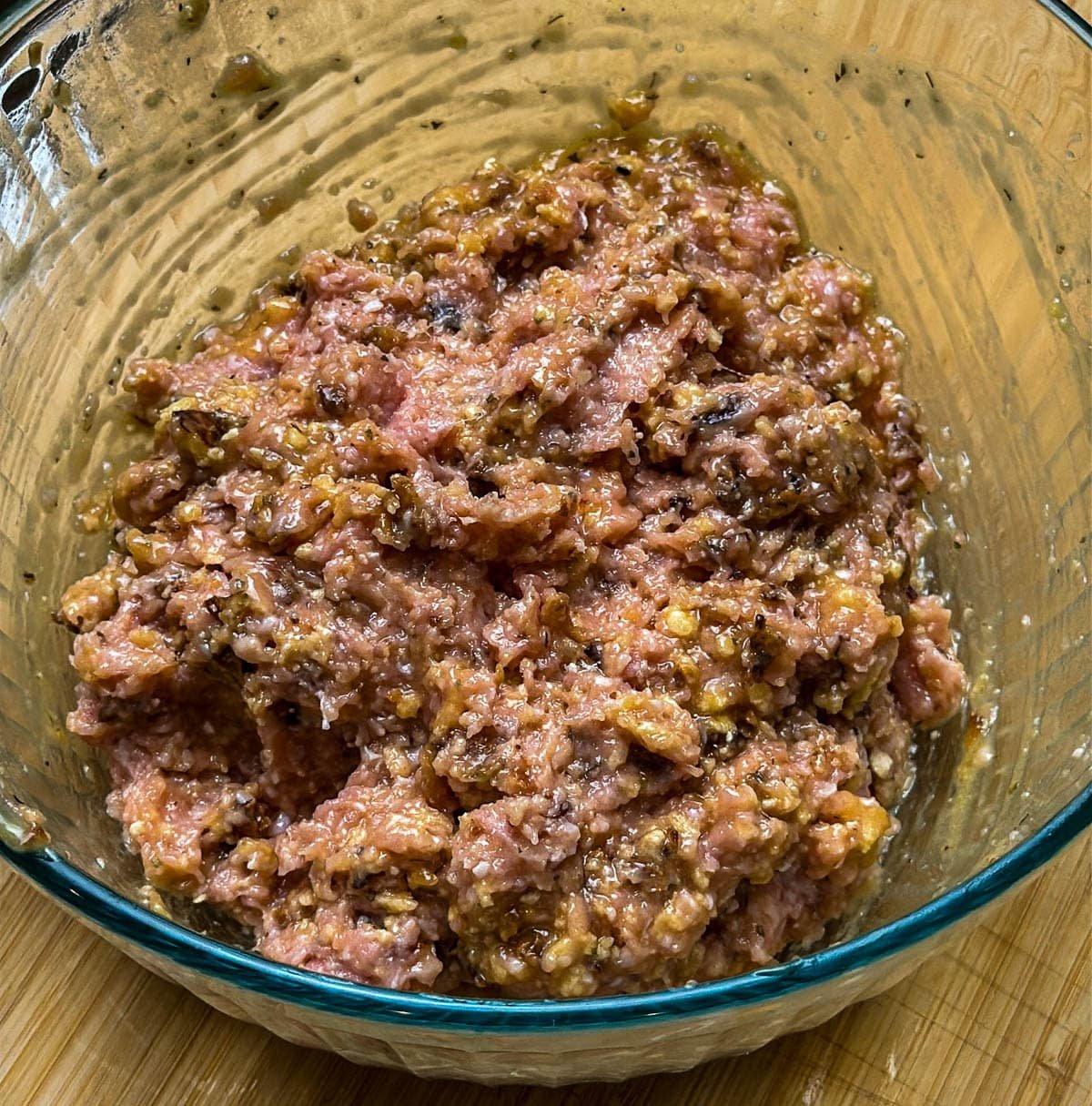 Wet ingredients, ground turkey, and bread crumbs are fully combined to make the ground turkey meatballs mixture.