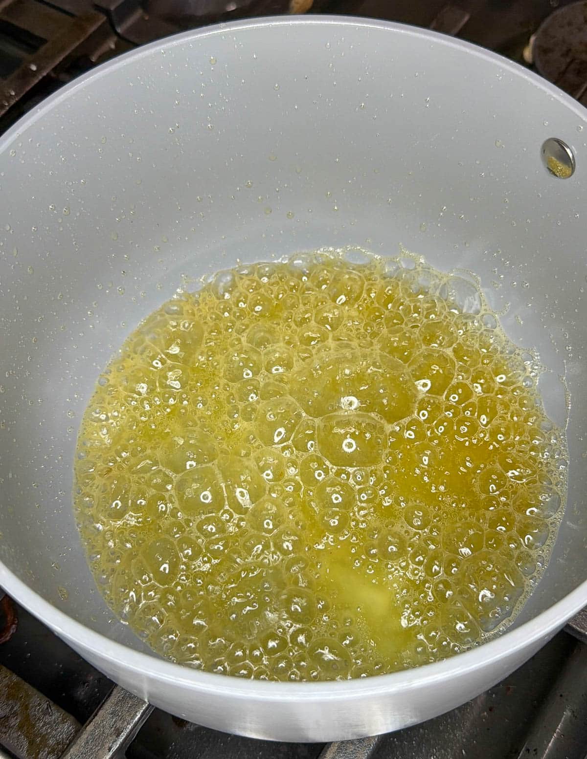 Butter bubbling in a saucepan. 