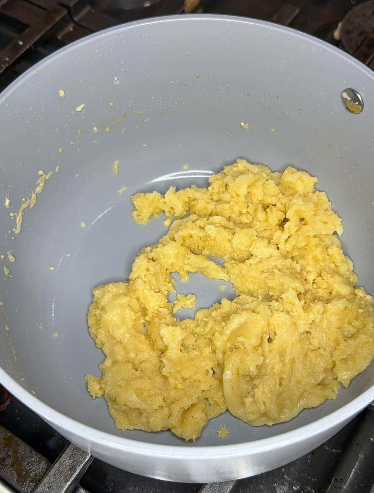 Butter and flour is cooked for a minute to thicken the roux base.