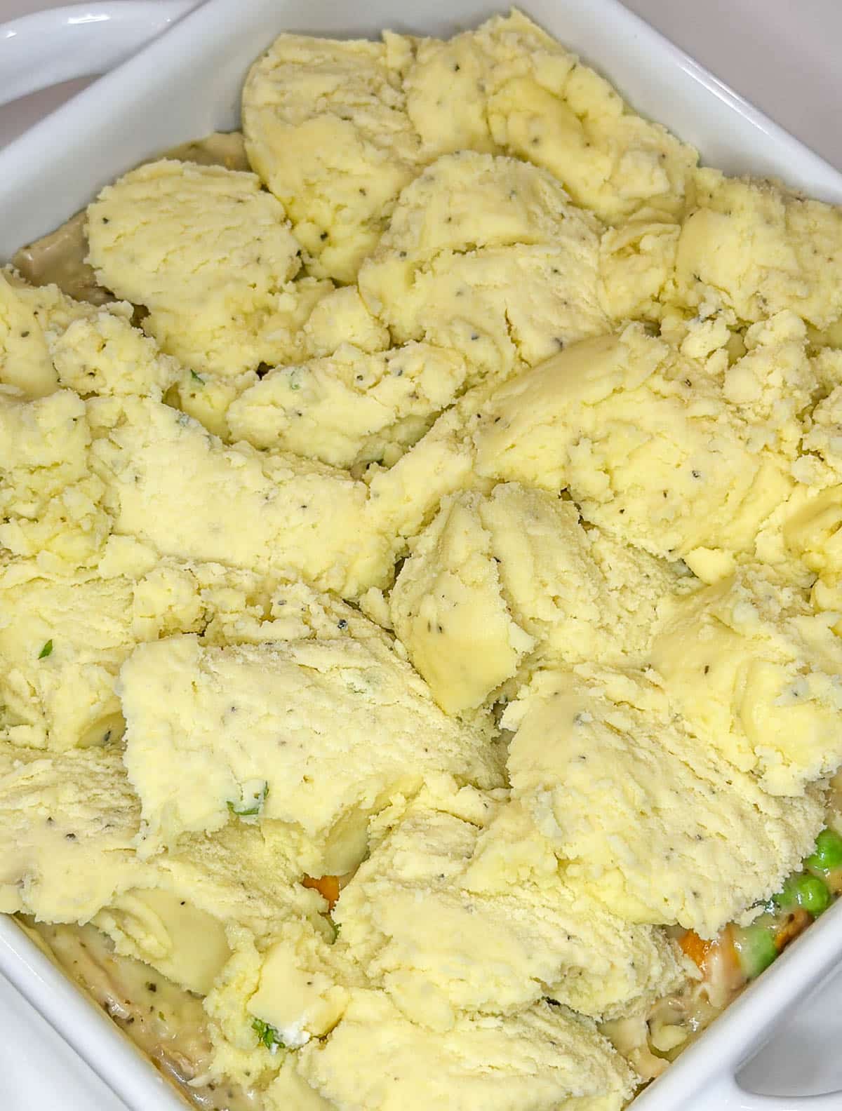 The casserole is topped with leftover mashed potatoes.