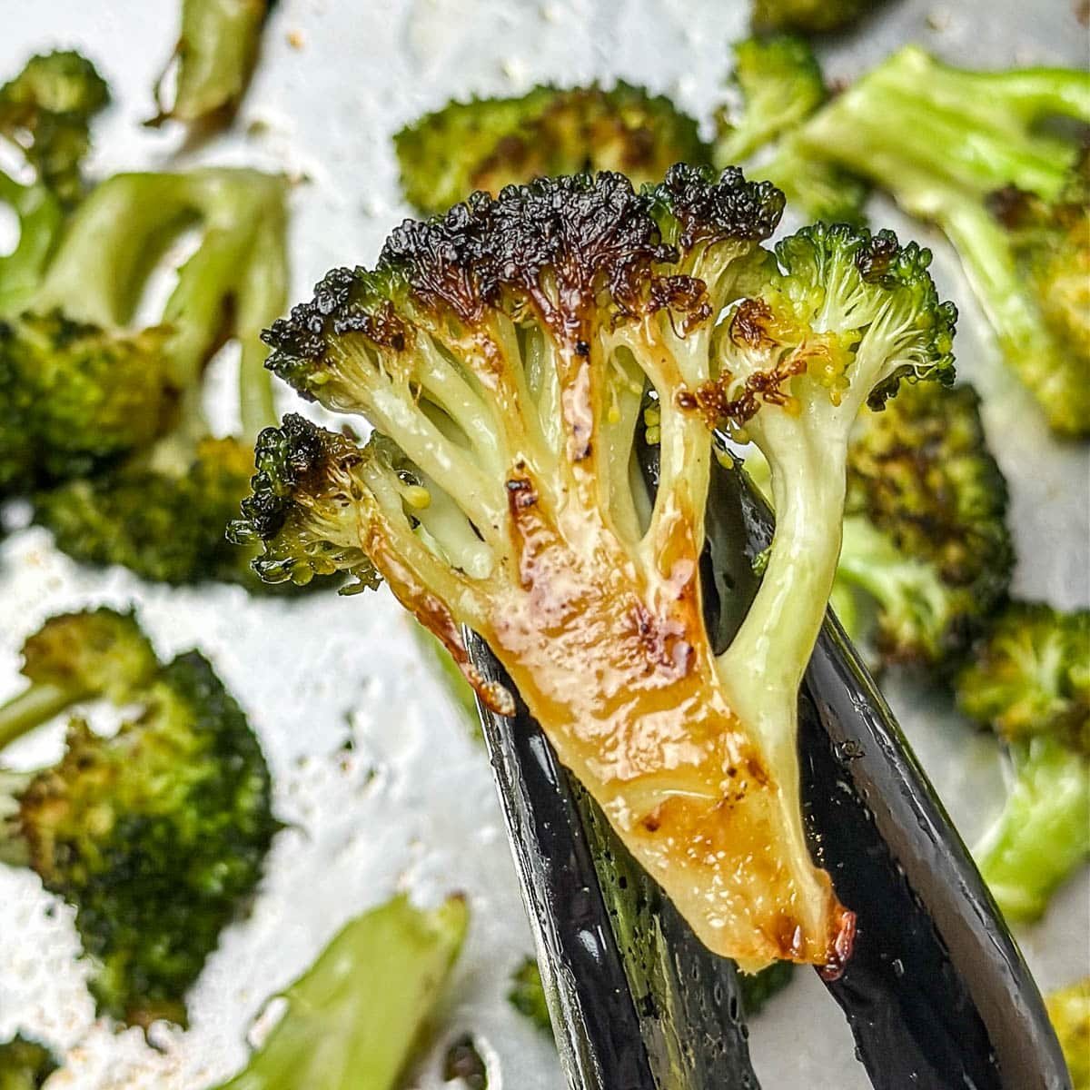 A close-up photo of oven roasted broccoli.