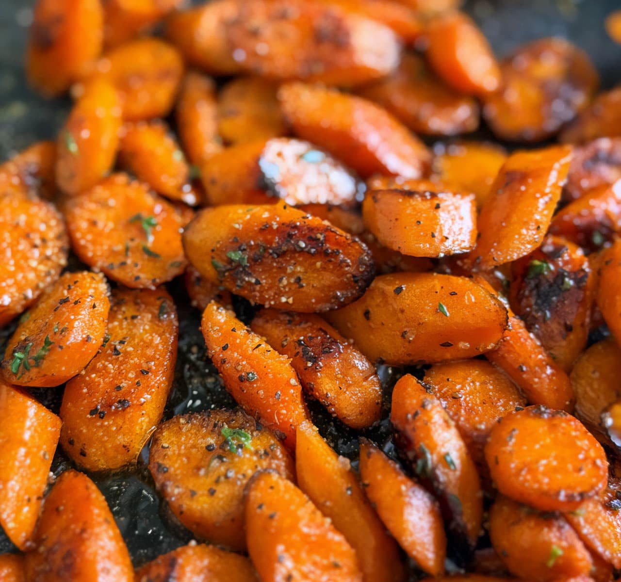 A close-up photo of sautéed carrots.