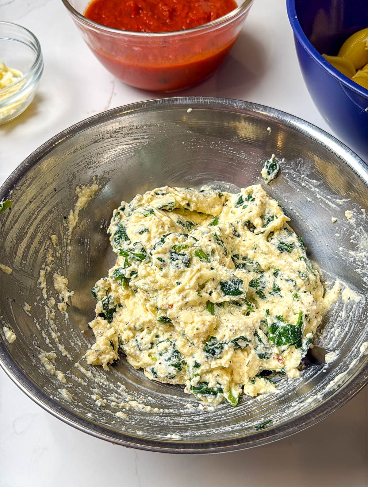 Spinach and cheese mixture fully combined.