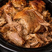 close up of slow cooker pulled pork in a crock pot