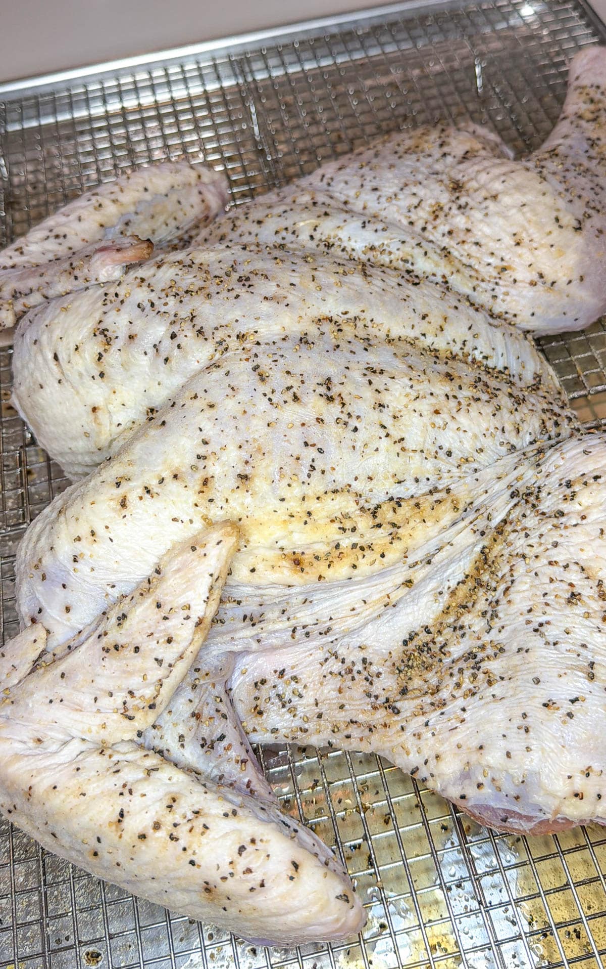 Spatchcocked turkey with copound butter underneath the skin.