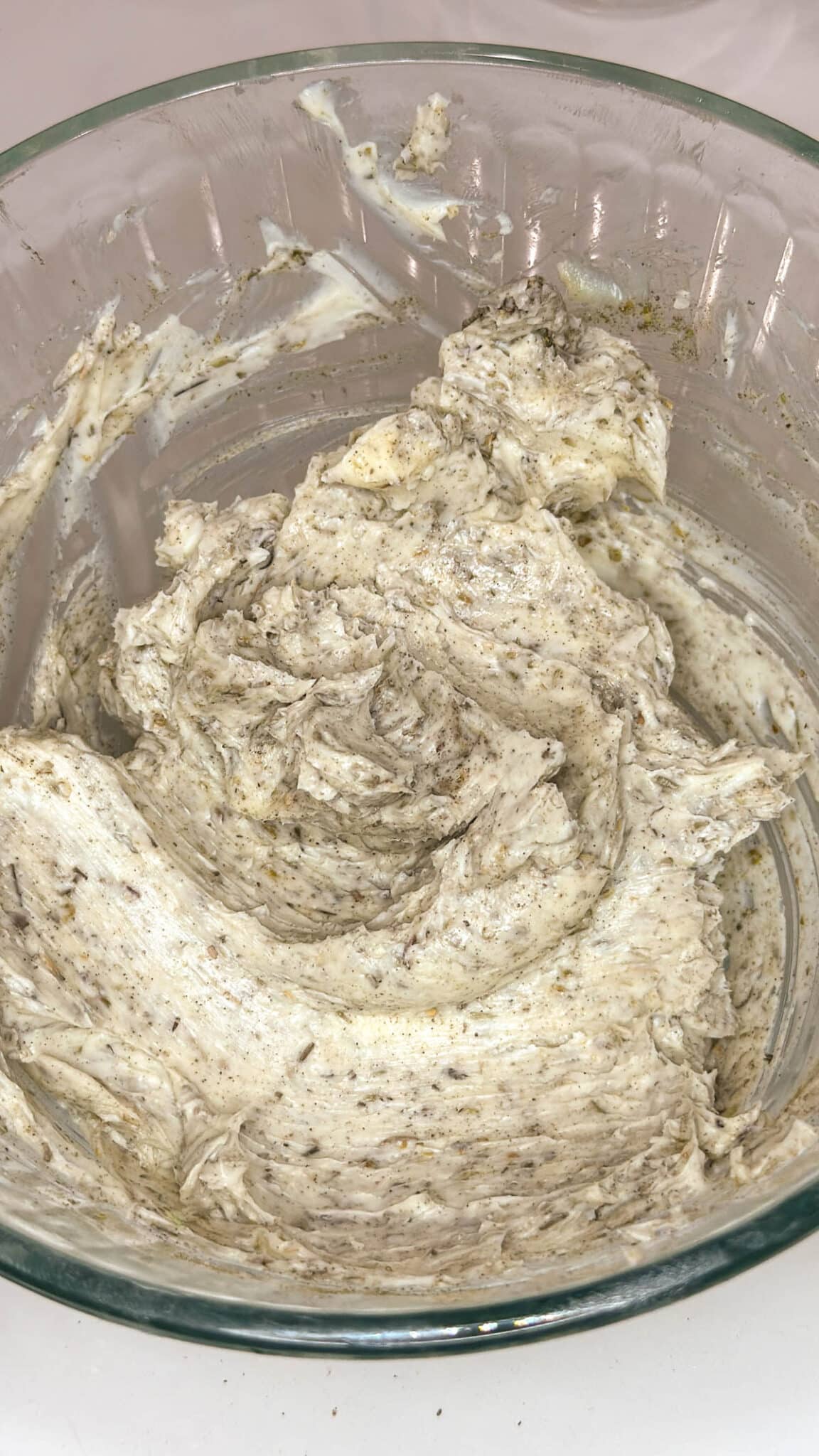 Softened butter and seasoning fully combined in a small bowl.