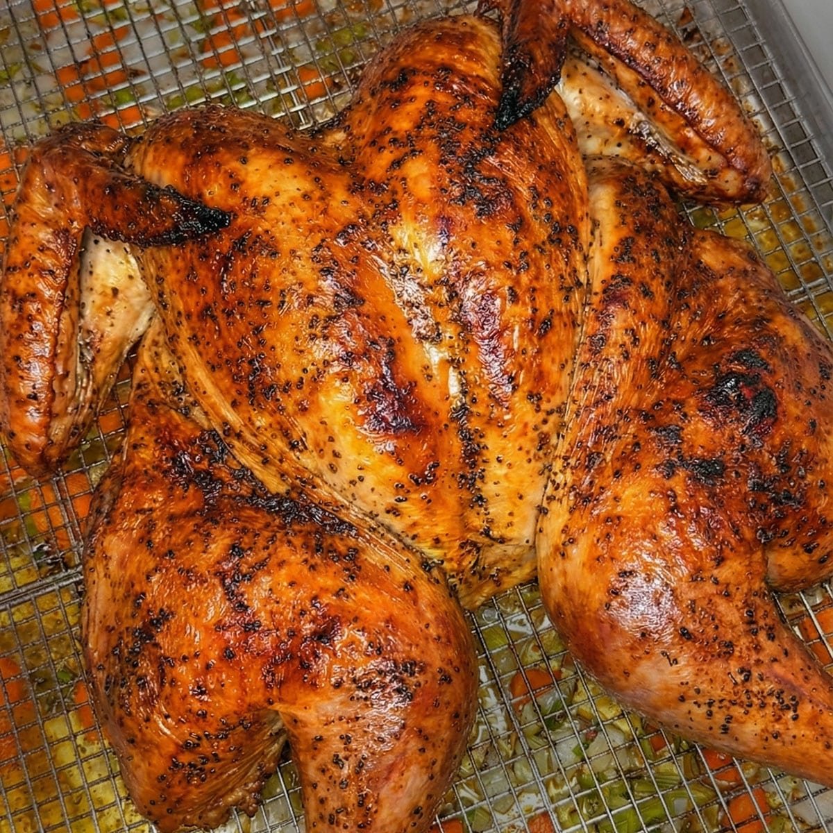 A close-up photo of a roasted spatchcock turkey.