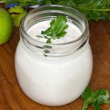close up of a jar of cilantro lime crema