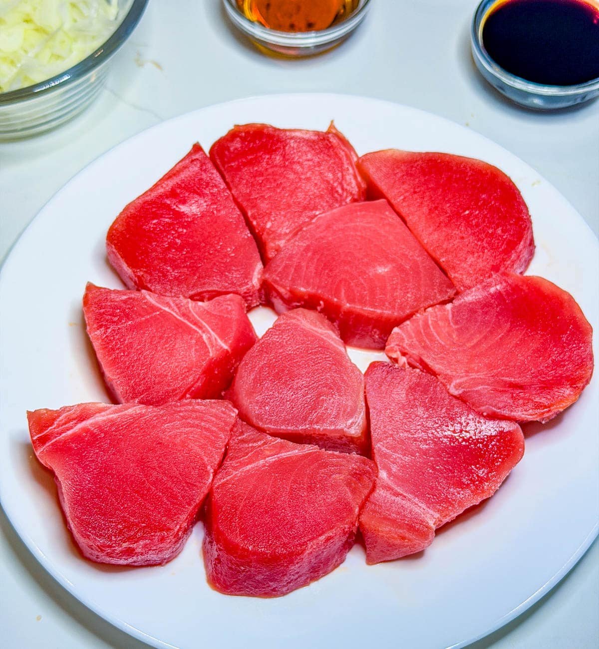 close up of fresh tuna on a white plate