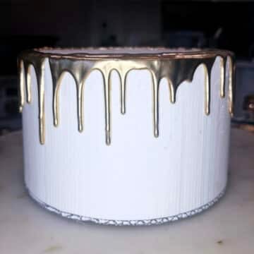 gold drip on a white cake