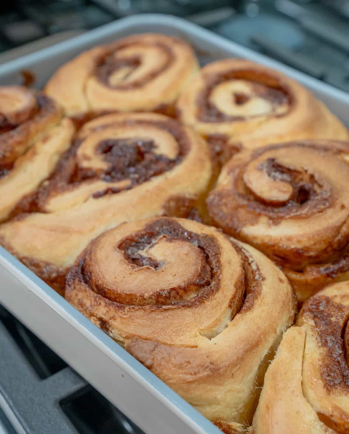 Close up of baked sourdough cinnamon rolls.