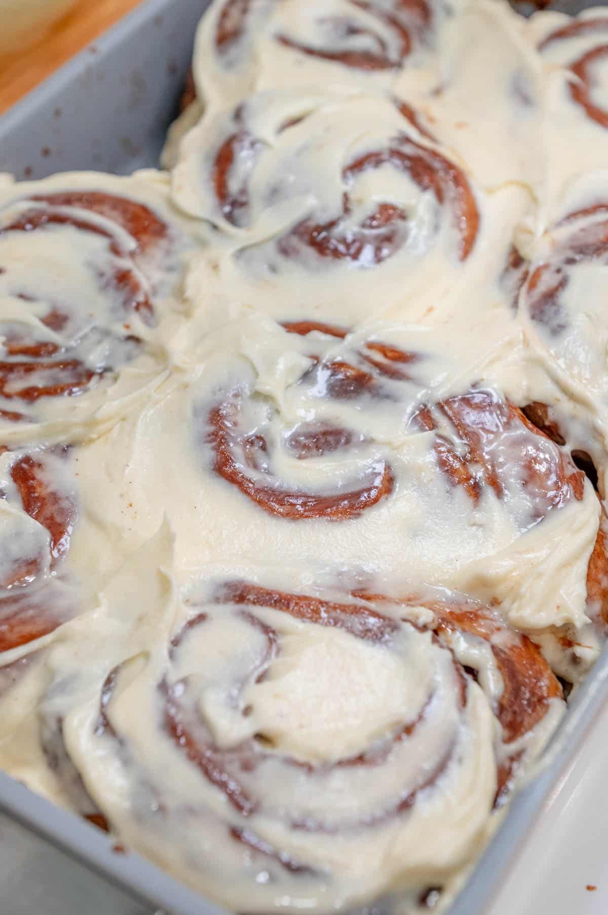 Cinnamon rolls covered in cream cheese frosting.