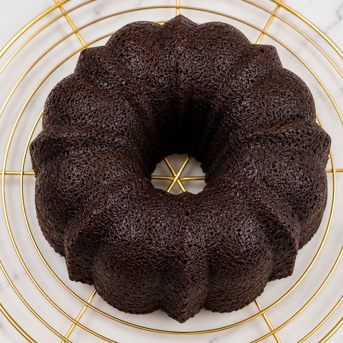 Wine bundt cake on a cooling rack