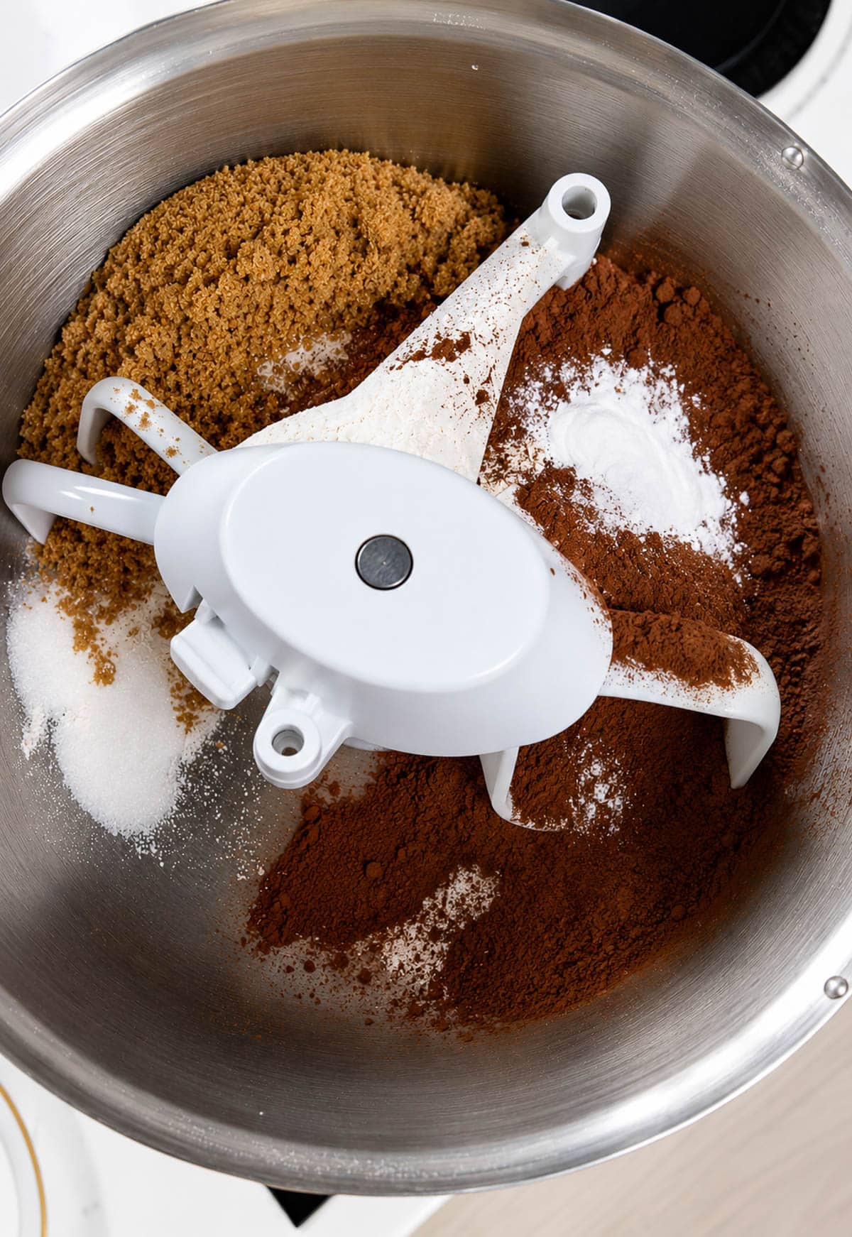 Wine cake dry ingredients in the bowl of a stand mixer.