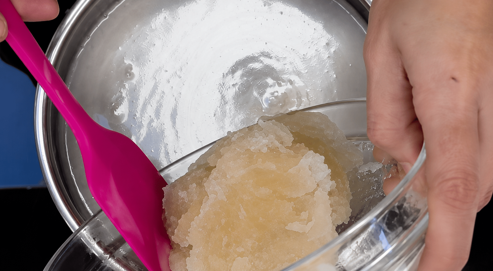 Gelatin being added to the hot syrup in the pan.