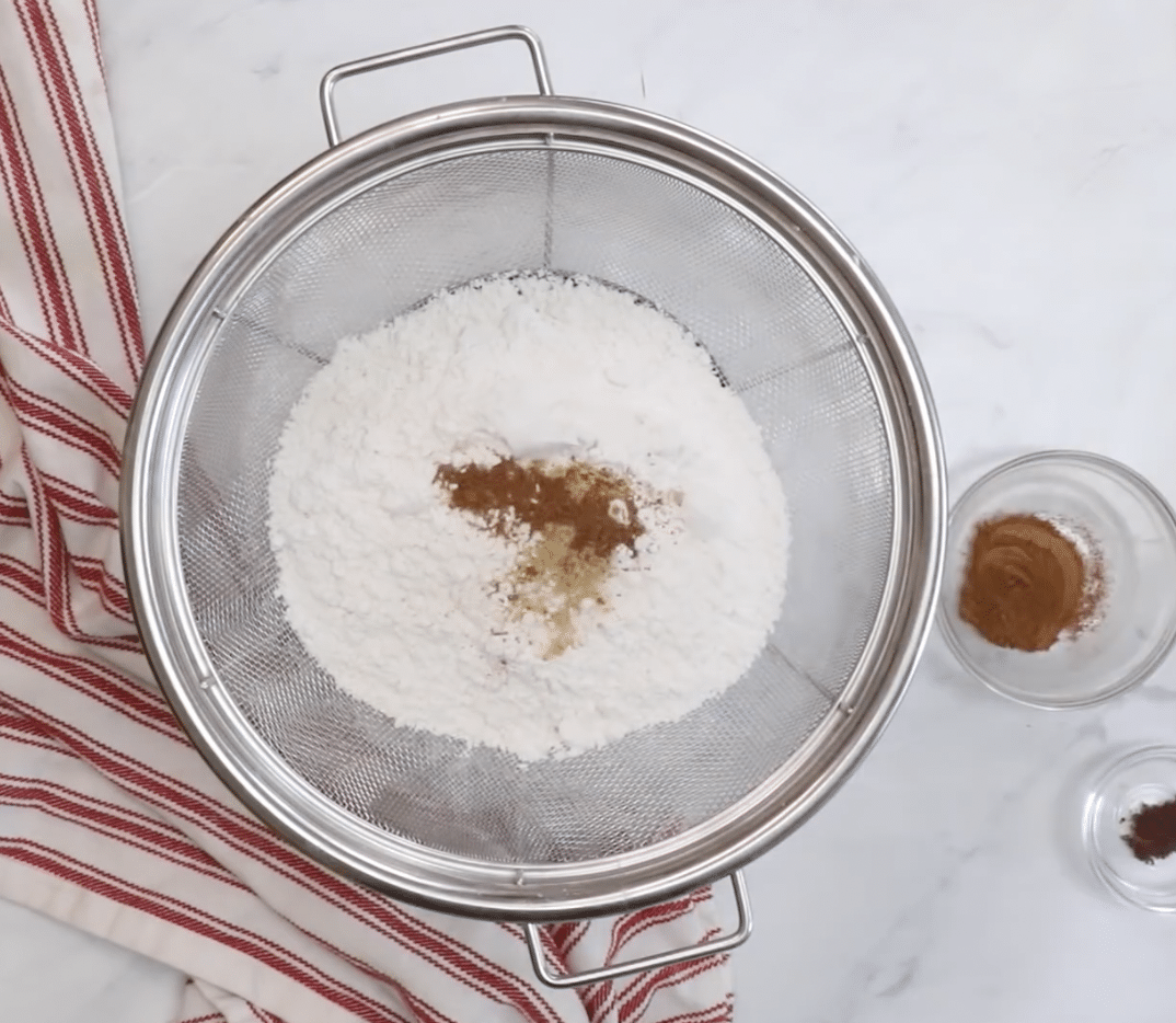 Sifting dry ingredients together.