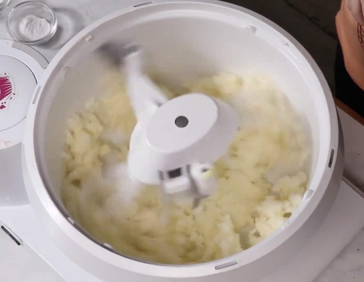 Softened butter in the bowl of a stand mixer.