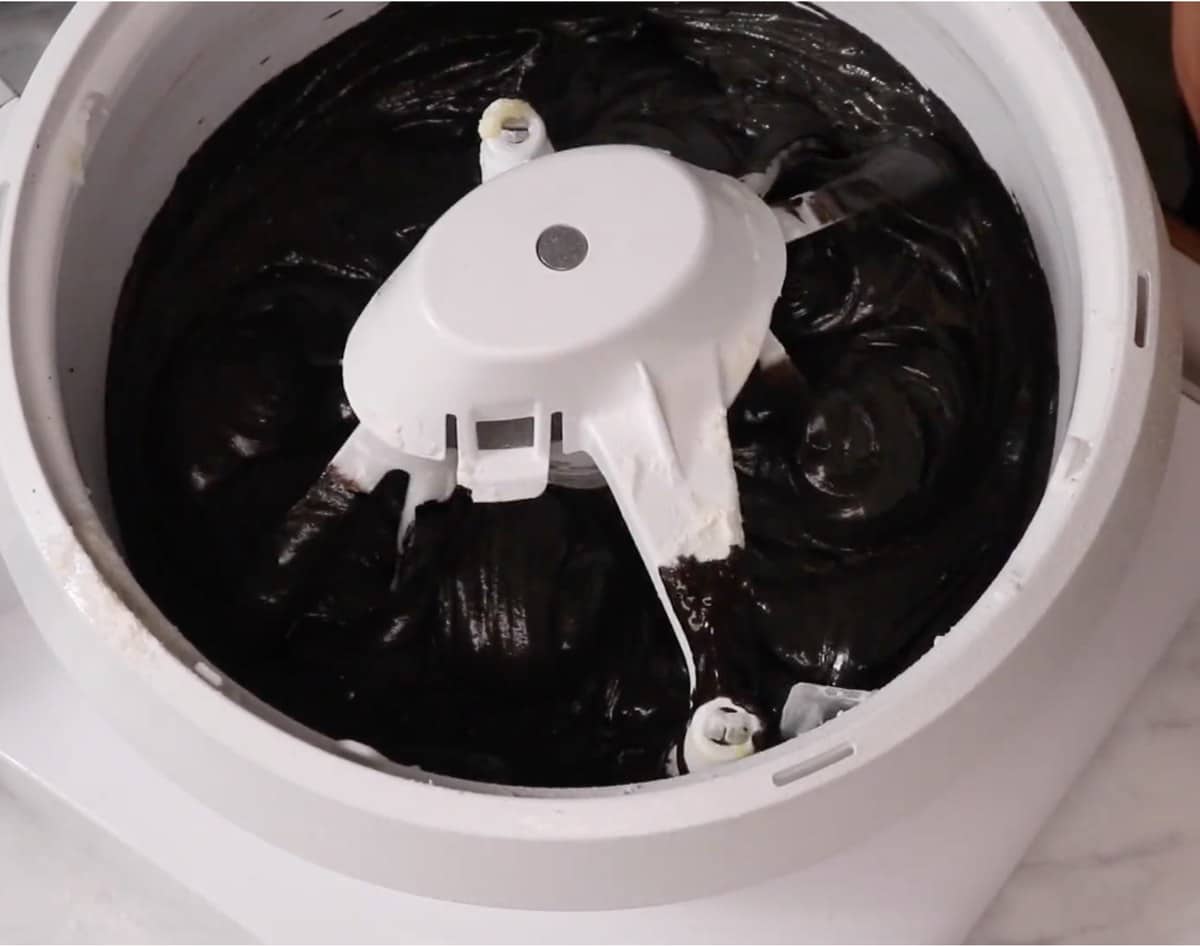 Smooth black velvet cake batter in a stand mixer.