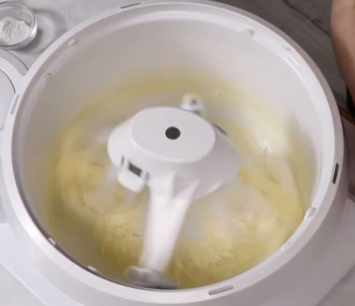 Butter creamed until smooth in the bowl of a stand mixer.