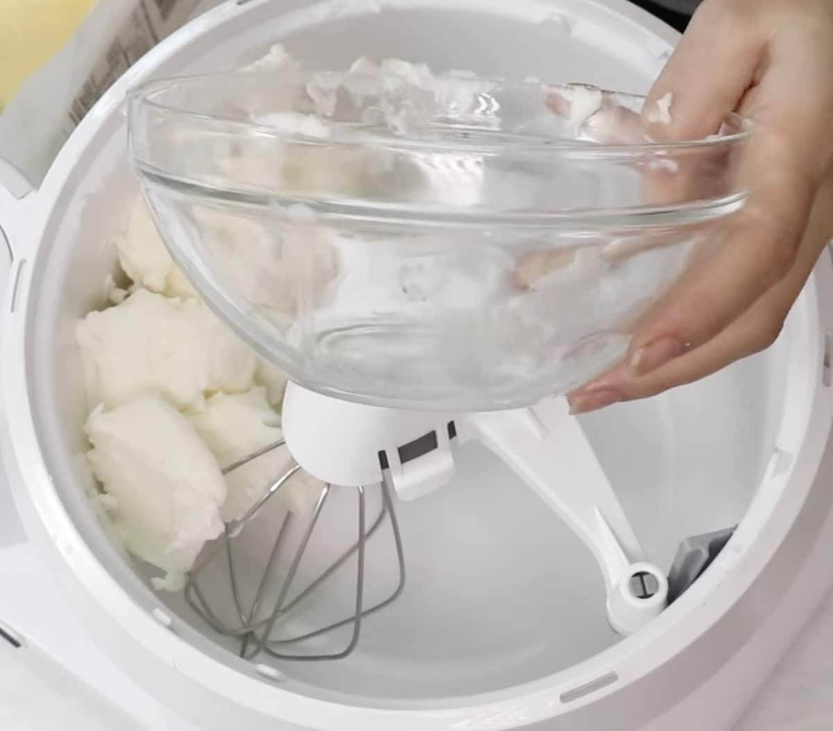 Adding vegetable shortening to butter in a stand mixer with the whisk attachment.