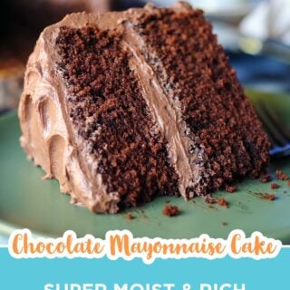 Slice of chocolate mayonnaise cake with chocolate buttercream on a green plate.