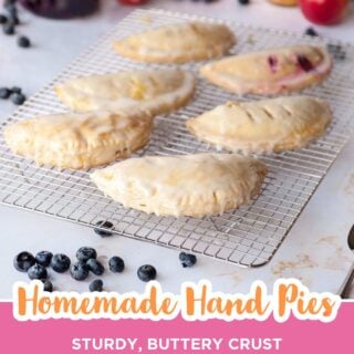 glazed hand pies on a cooling rack with jam and fresh fruit