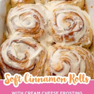 Pan of soft cinnamon rolls covered in cream cheese frosting