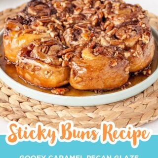 homemade pecan sticky buns on a blue plate on a woven placemat